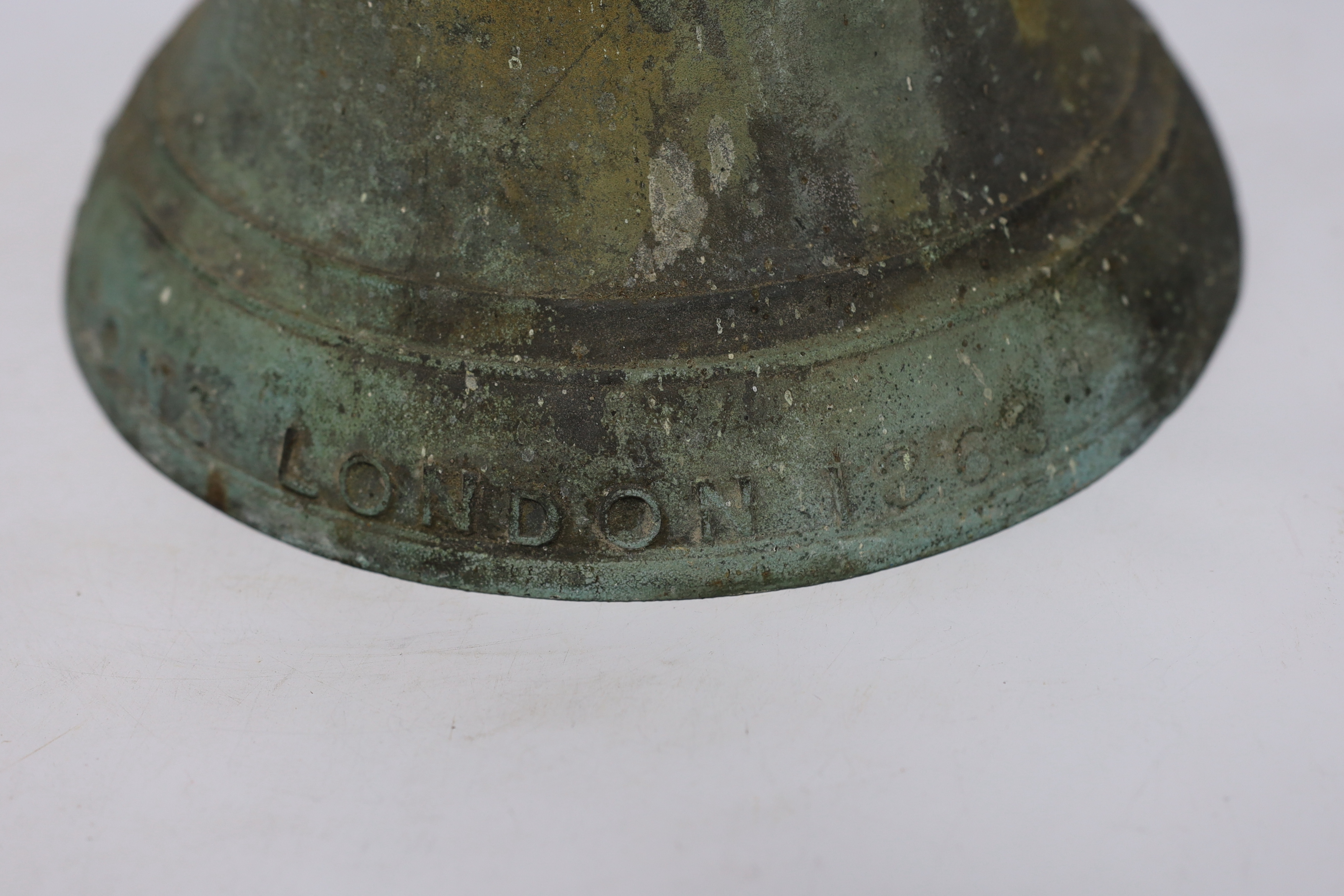 A heavy bronze bell cast by J Warner & Sons, London, 1863, 29cm high